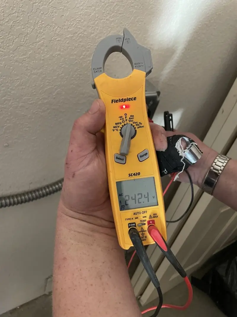 Voltage testing with clamp meter during Ceiling Fan Installation in Shallotte